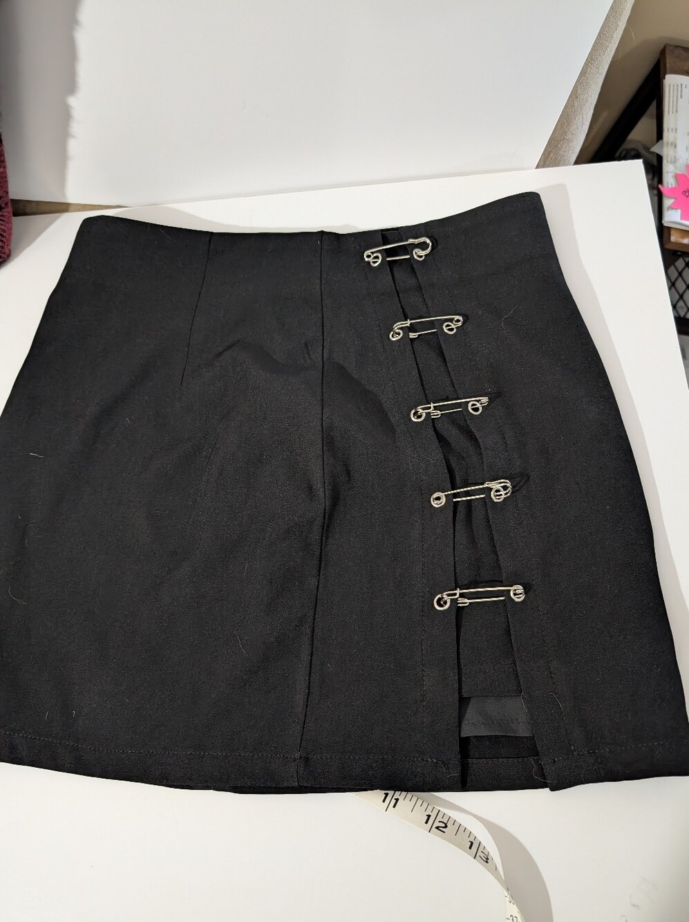 Cider Lined Black Mini Skirt with Decorative Silver Hook Details